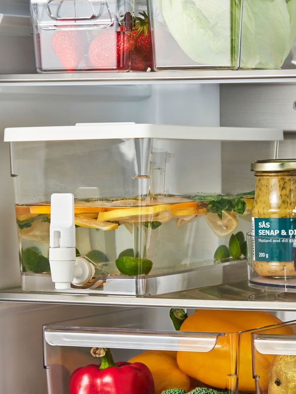 A transparent KLIPPKAKTUS container w tap disp for fridge