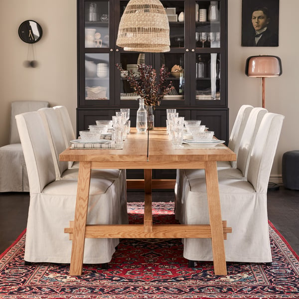 A dark brown HAVSTA storage combination w glass-doors in the dining room