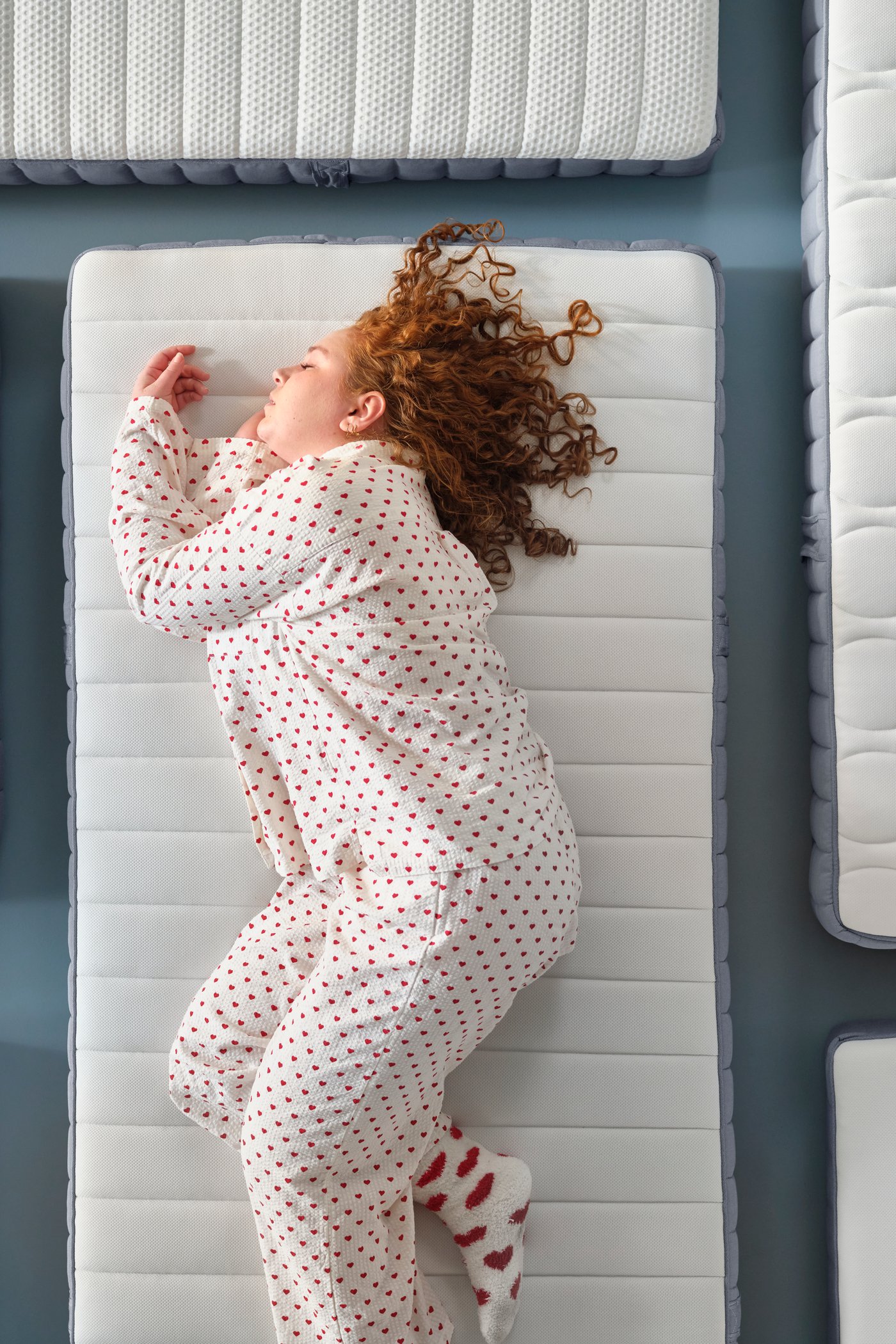 A firm/light blue VALEVÅG pocket sprung mattress