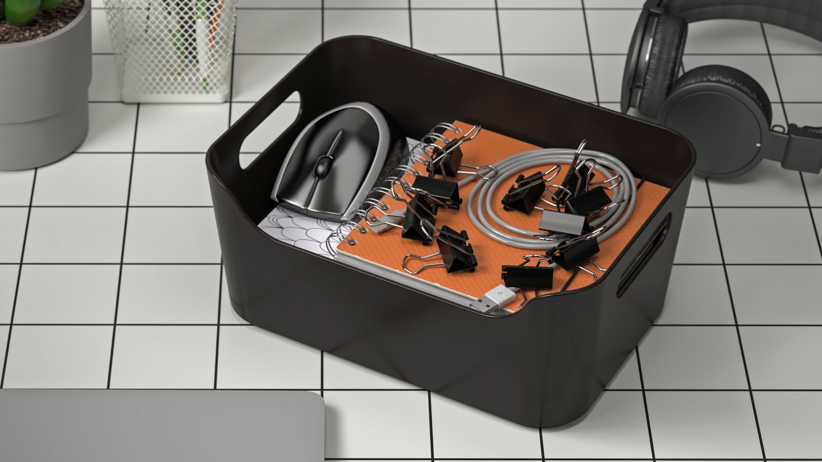 An organised anthracite storage box in a home workspace