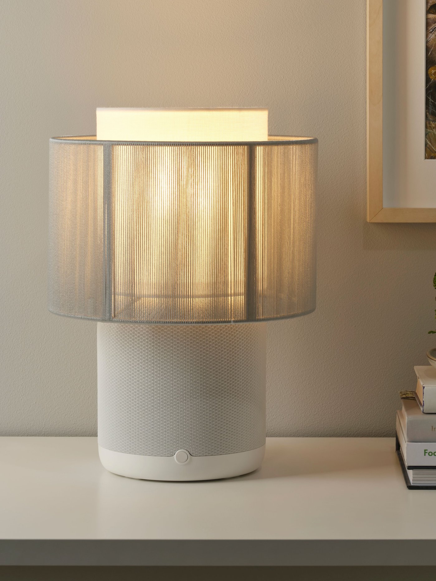 A white SYMFONISK speaker lamp w Wi-Fi, textile shade