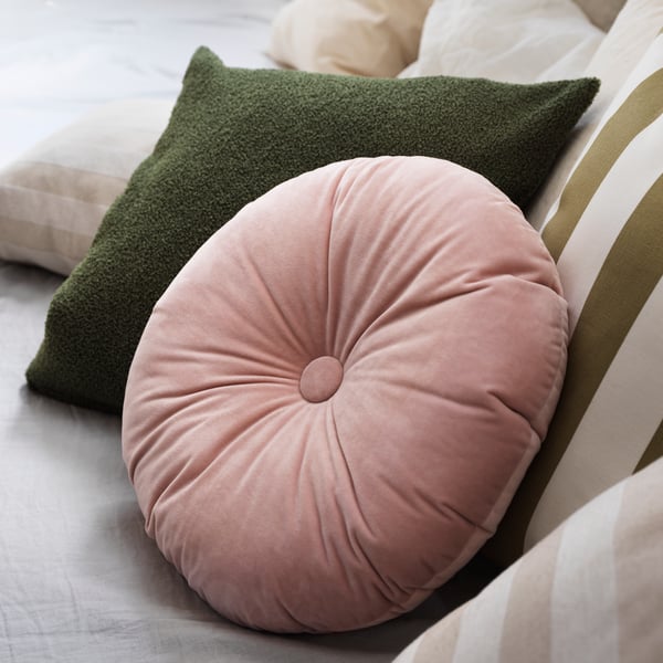 A light pink KRANSBORRE cushion