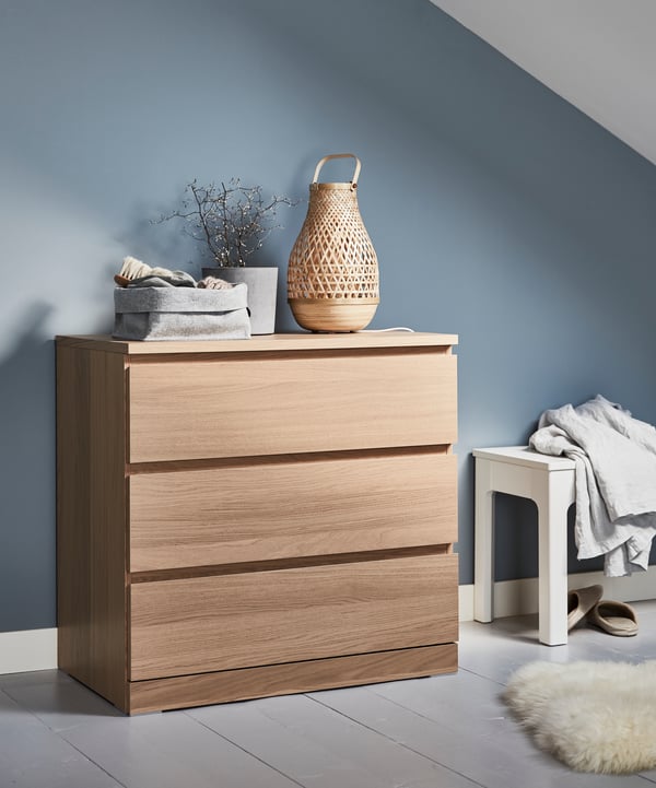 A bamboo/handmade MISTERHULT table lamp in the bedroom