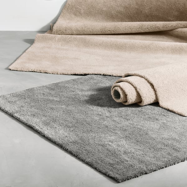 An off-white STOENSE rug, low pile