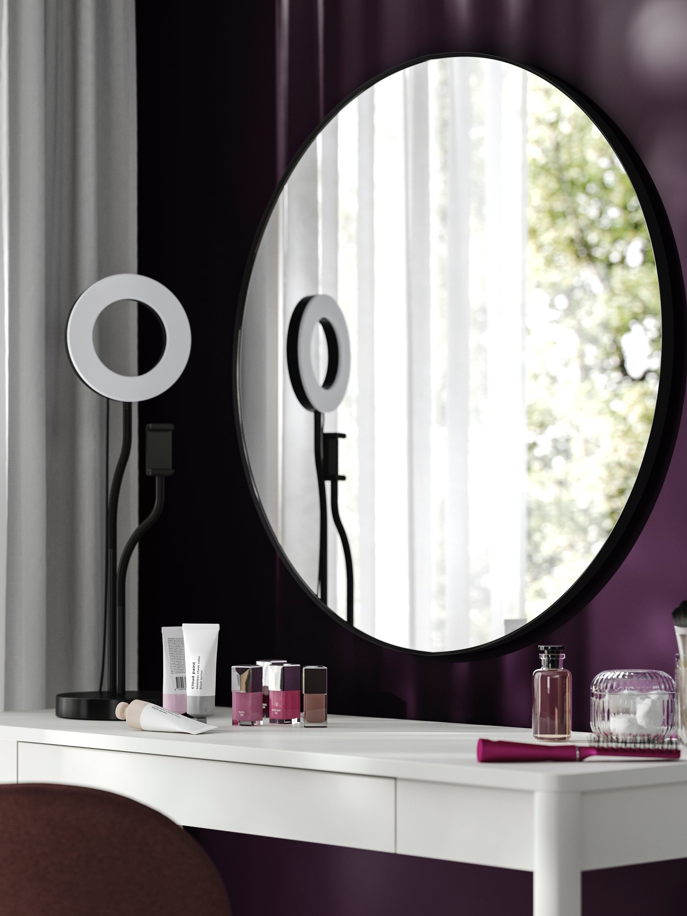 A round black LINDBYN mirror above a makeup table with a ring light.