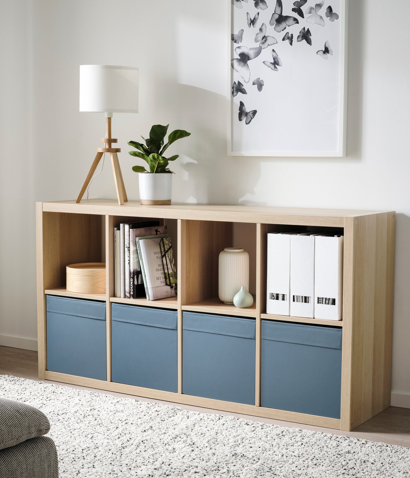 A white stained oak effect KALLAX shelving unit in the living room