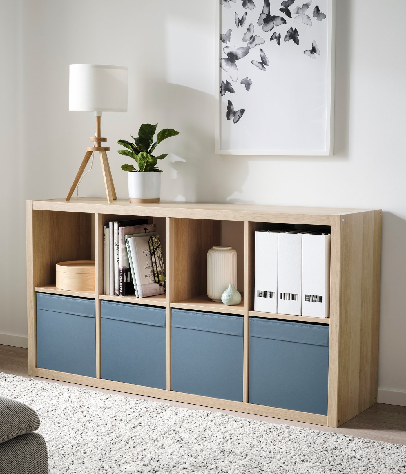 A white stained oak effect KALLAX shelving unit in the living room