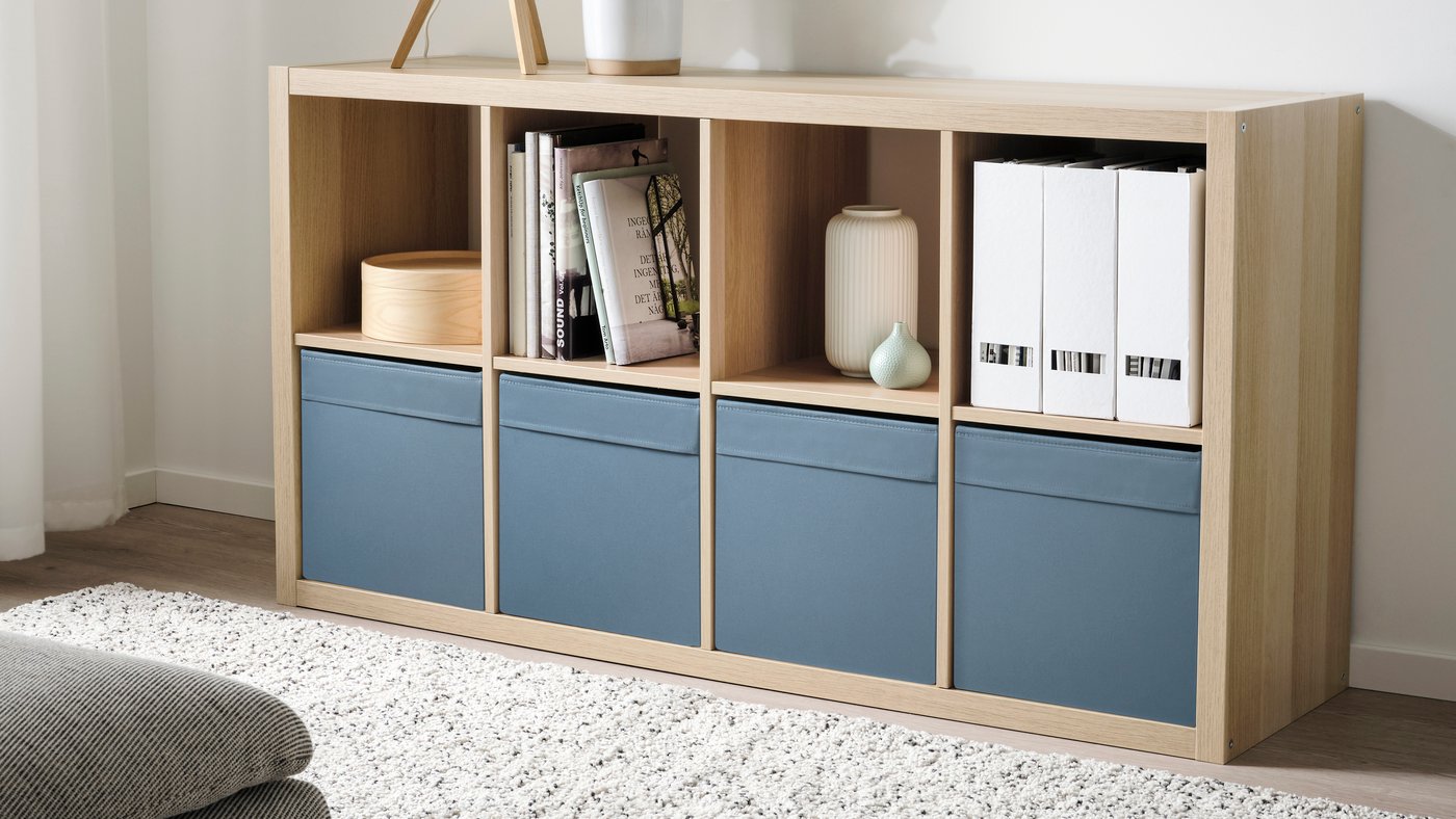 A white stained oak effect KALLAX shelving unit in the living room