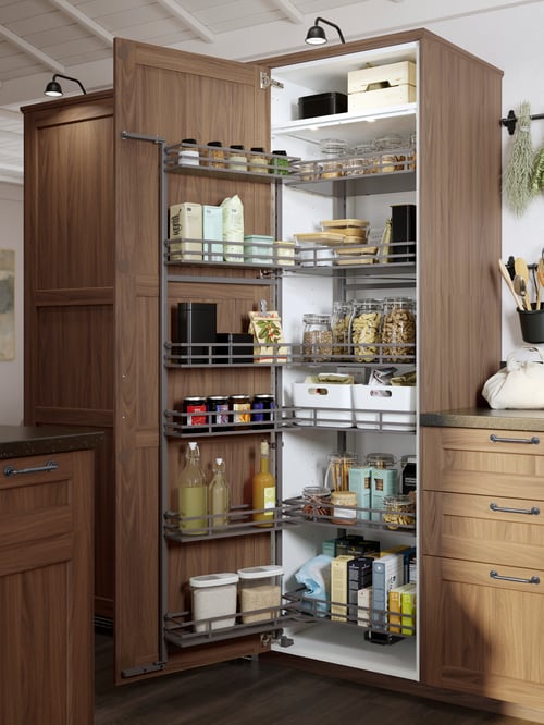 A UTRUSTA pull-out larder in a tall kitchen cabinet with a brown walnut-effect ENKÖPING door, with dry foods on the shelves.