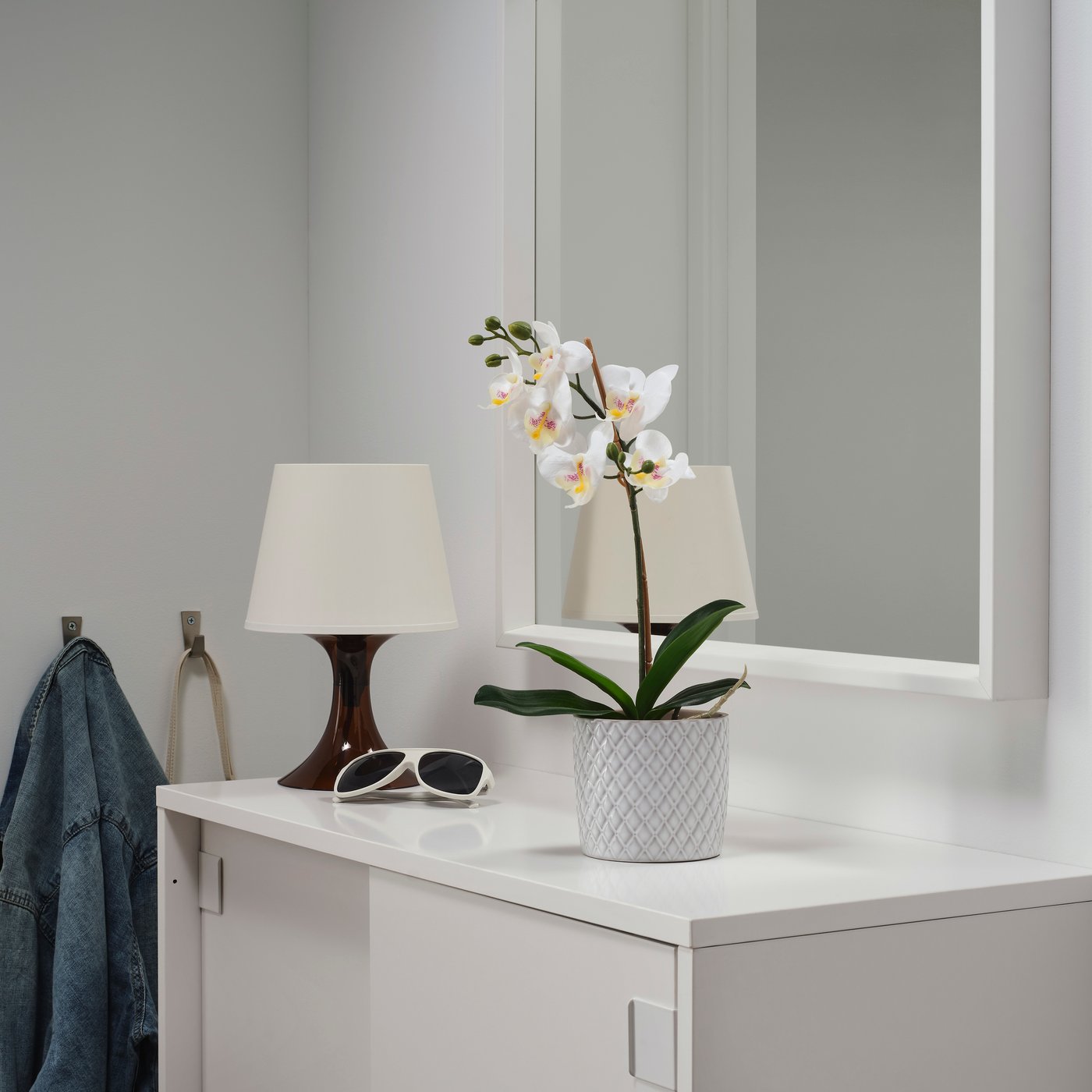 An Orchid white FEJKA artificial potted plant