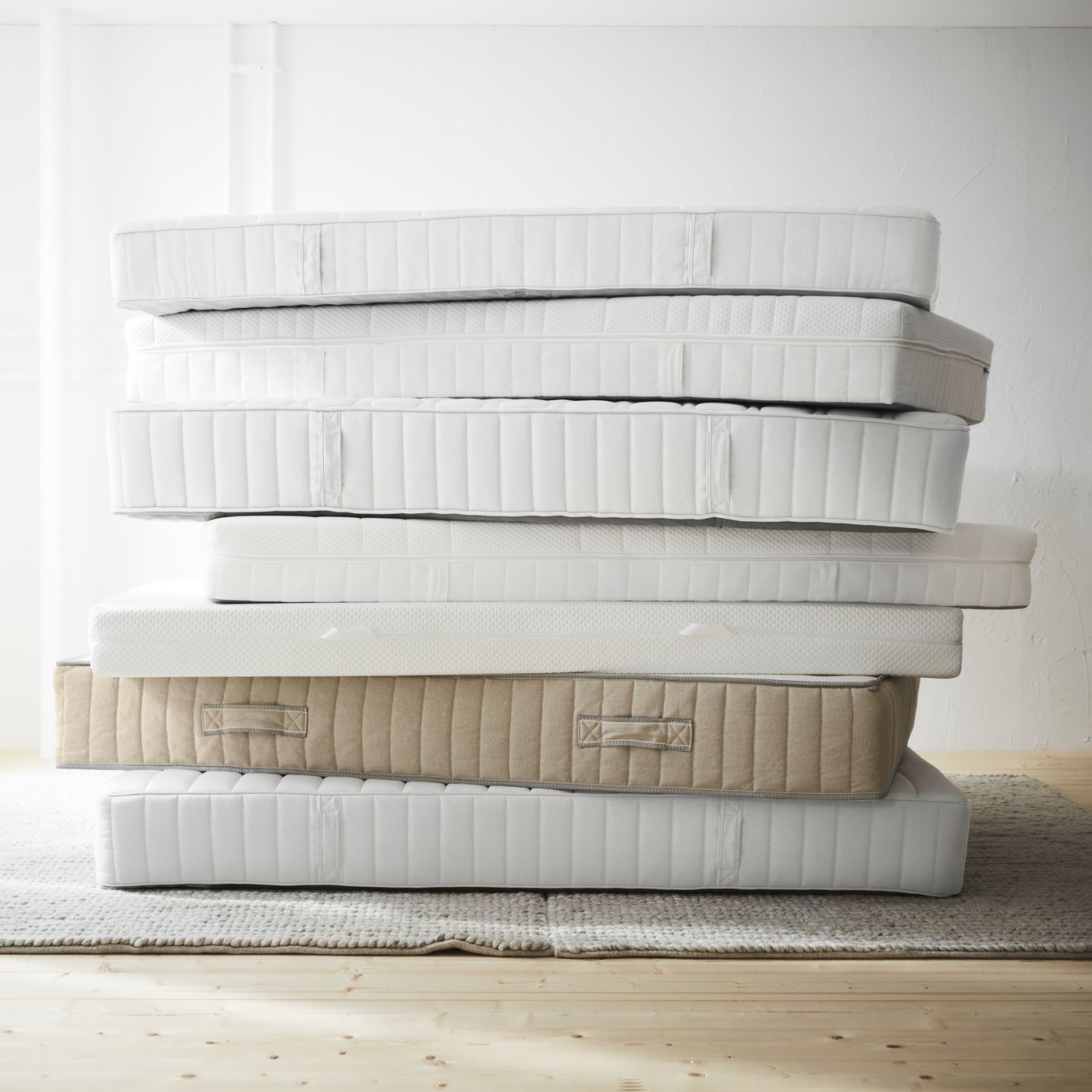 A firm/white VÅGSTRANDA hybrid mattress