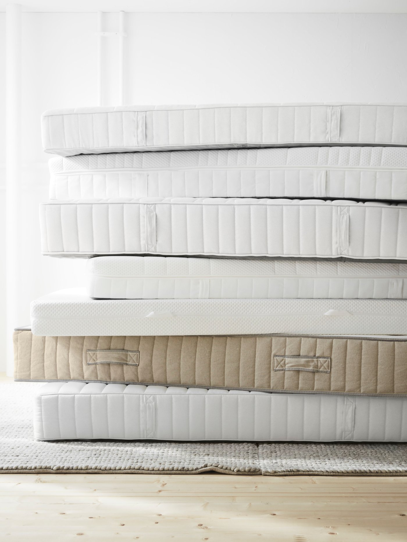 A firm/white VÅGSTRANDA hybrid mattress