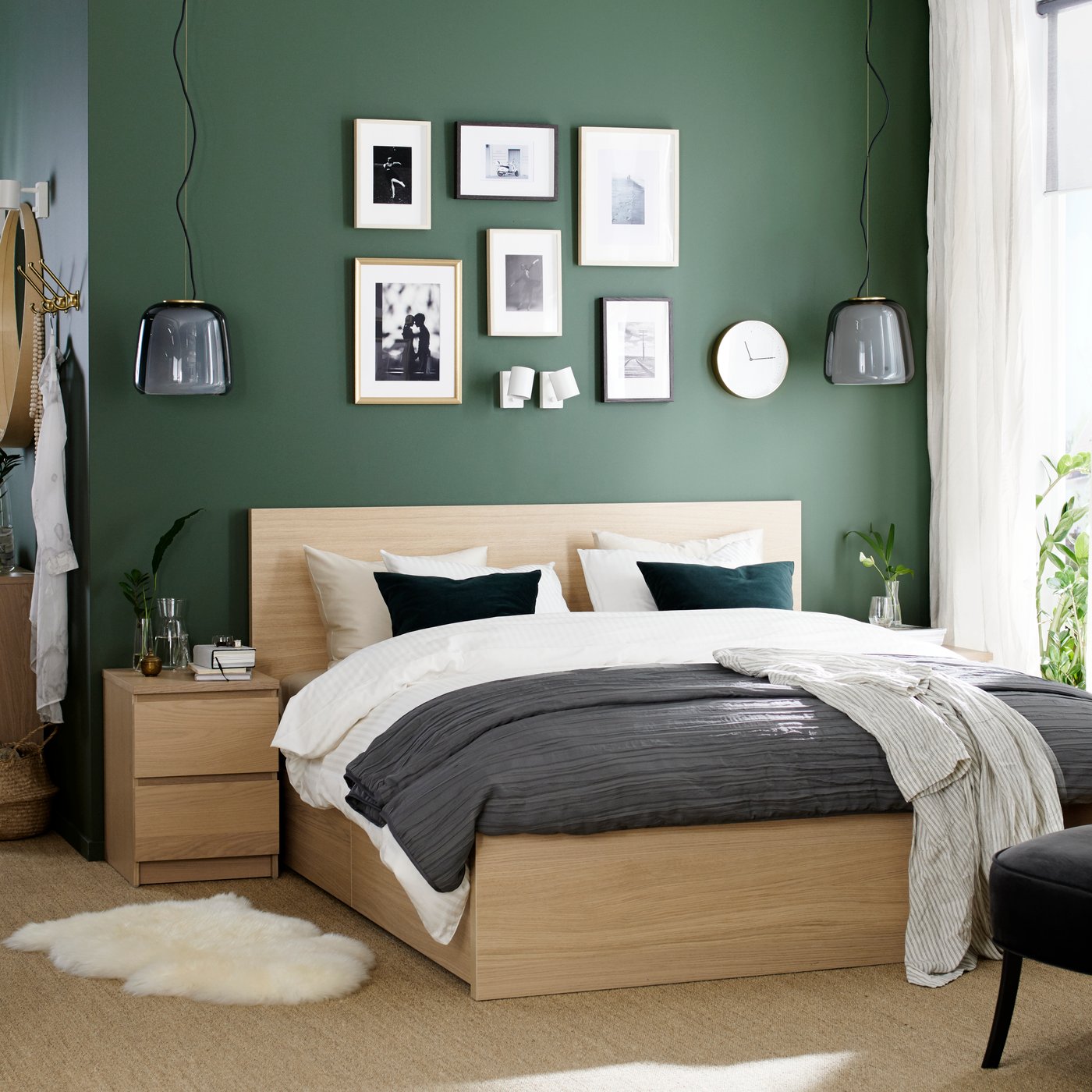A white stained oak veneer MALM bed frame, high, w 4 storage boxes in the bedroom