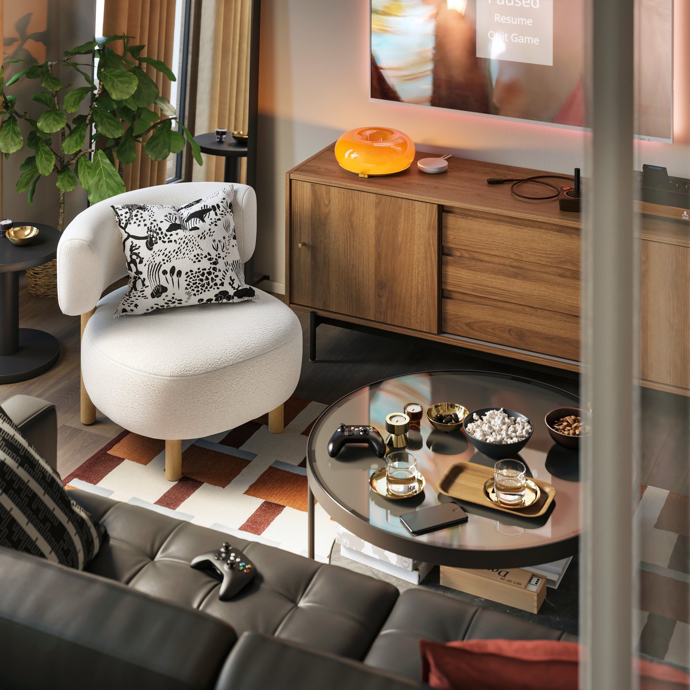 A STOCKHOLM armchair and FRÖTORP coffee table are by a RÅDMANSÖ TV bench. A VARMBLIXT LED table/wall lamp is on the bench.