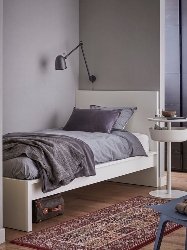 A white MALM bed frame, high