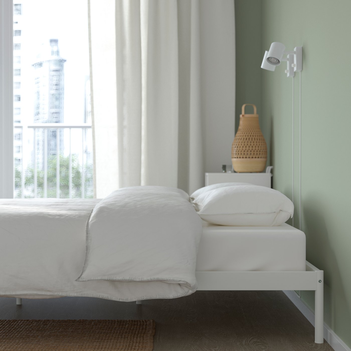 A white VEVELSTAD bed frame