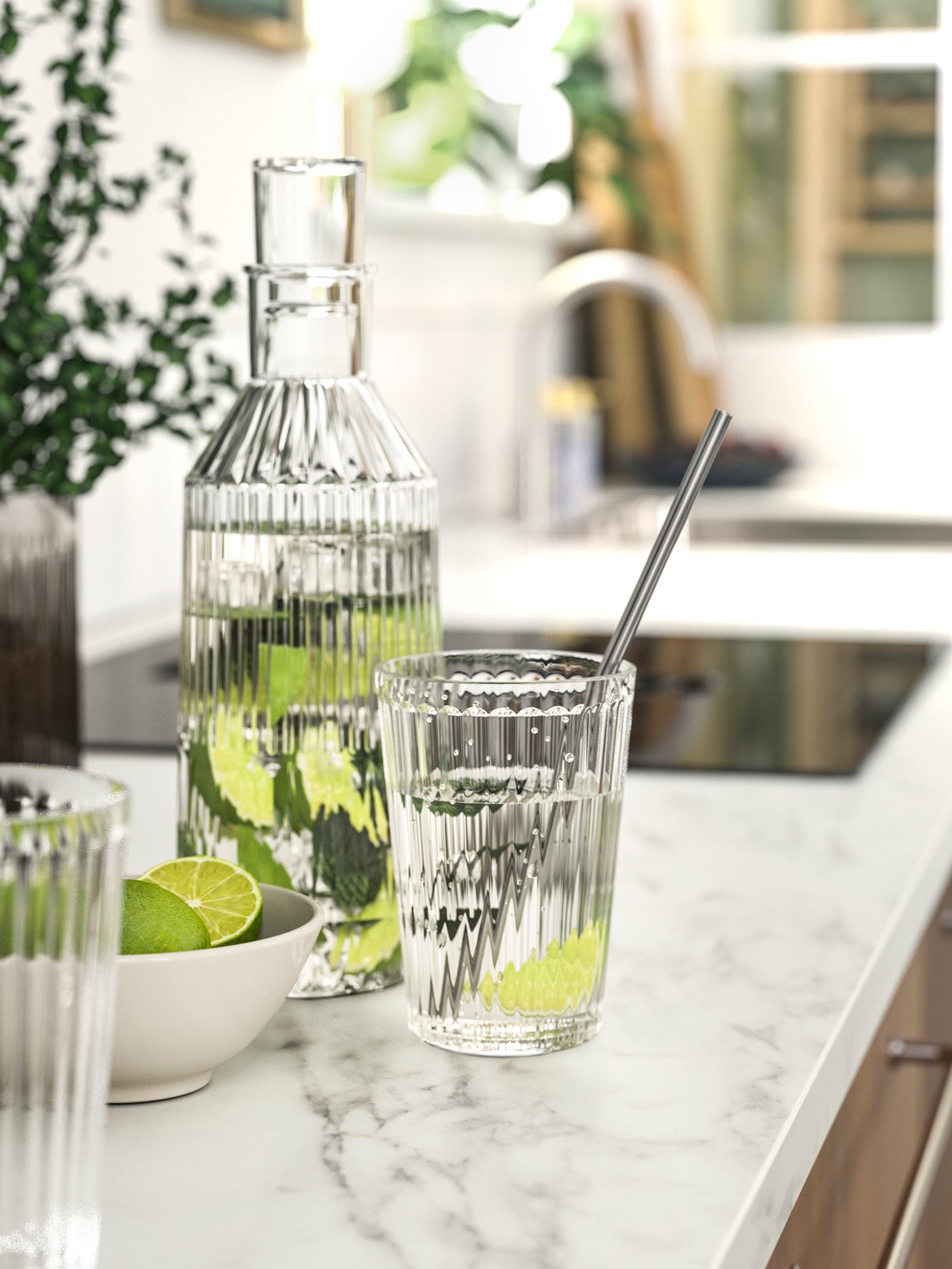 Två glas och en karaff står uppe på en köksbänk.