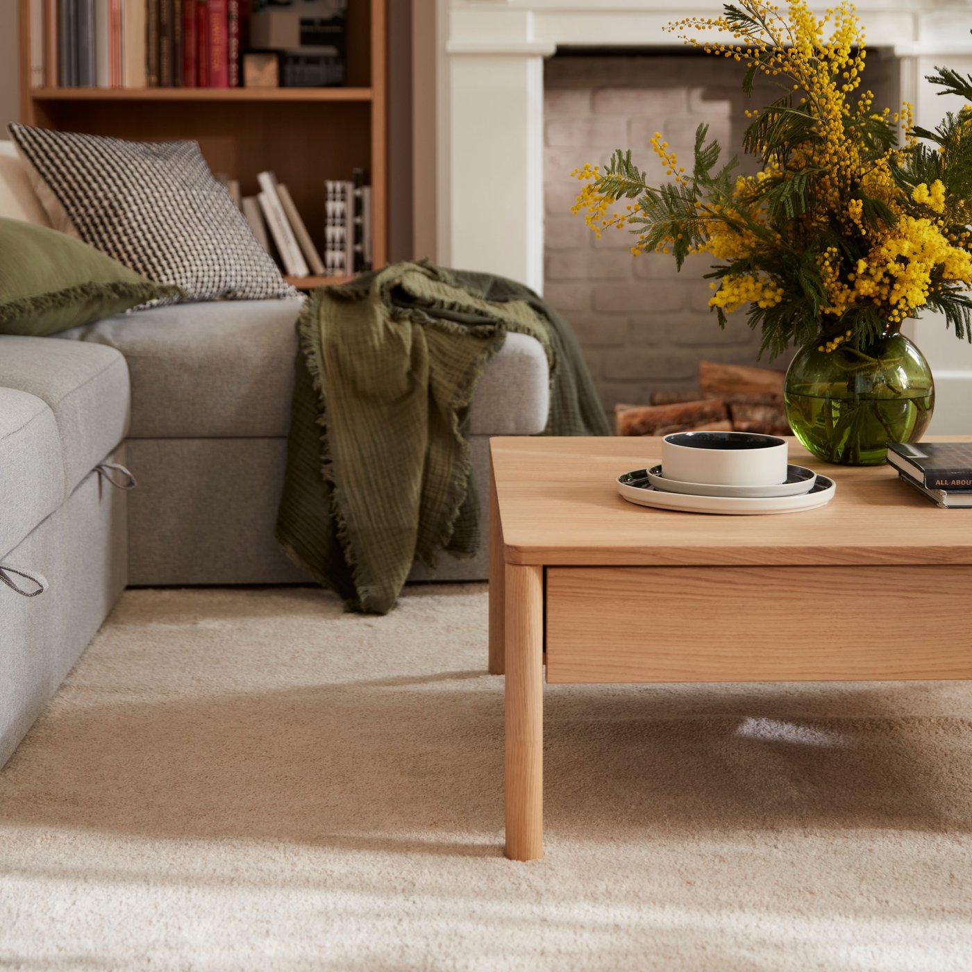 An off-white STOENSE rug, low pile in the living room