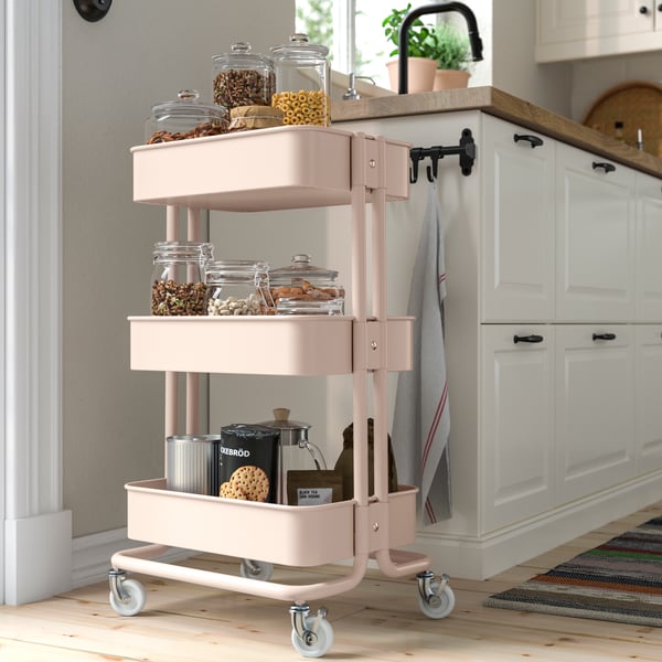 A pink RÅSKOG trolley