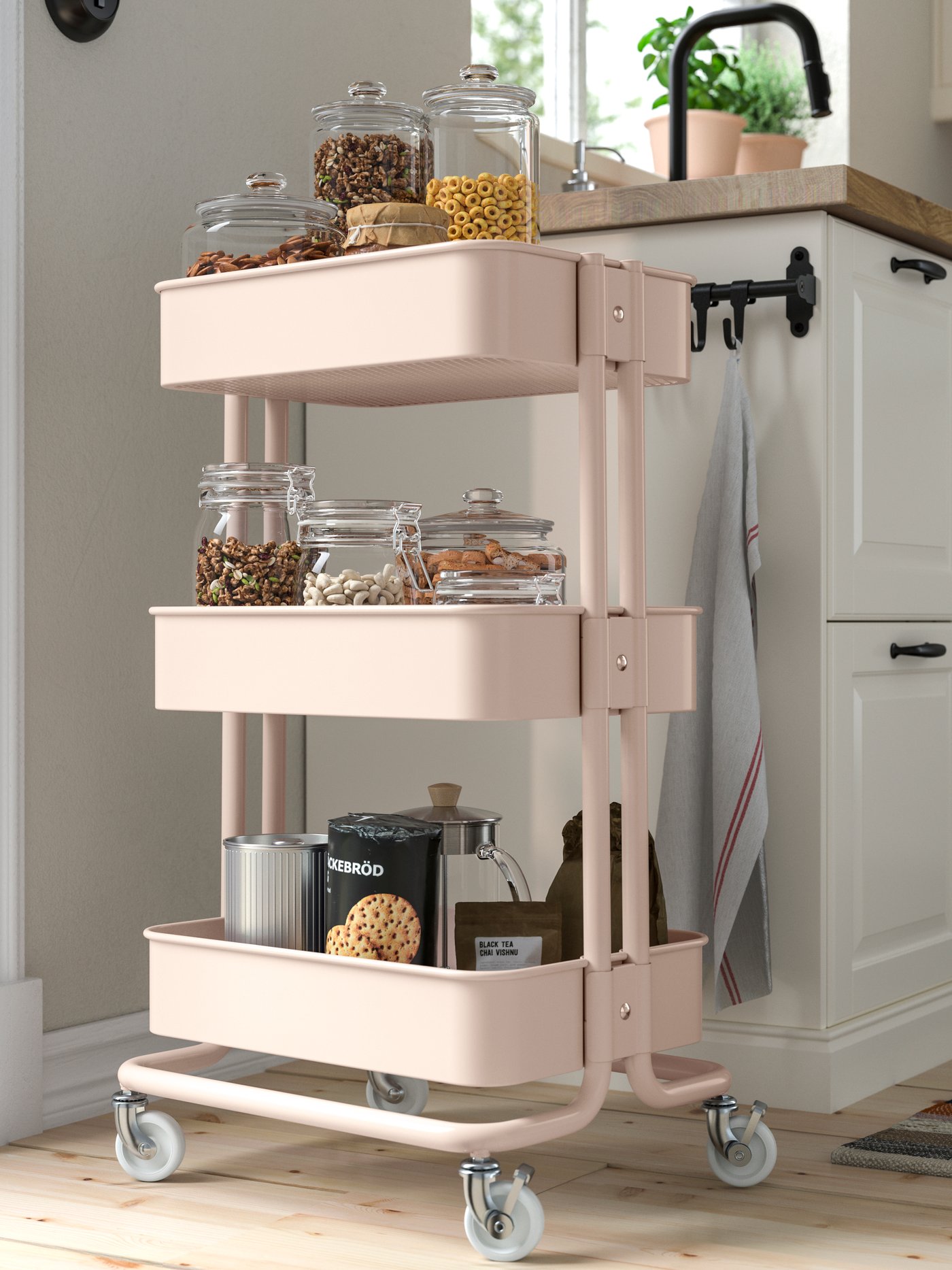 A pink RÅSKOG trolley