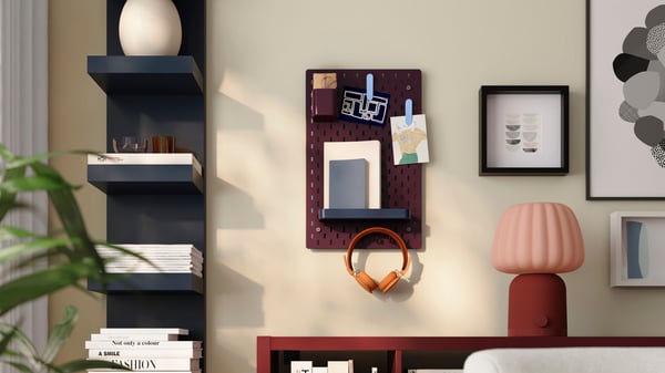 A multicolour SKÅDIS 7-piece accessories set in the living room