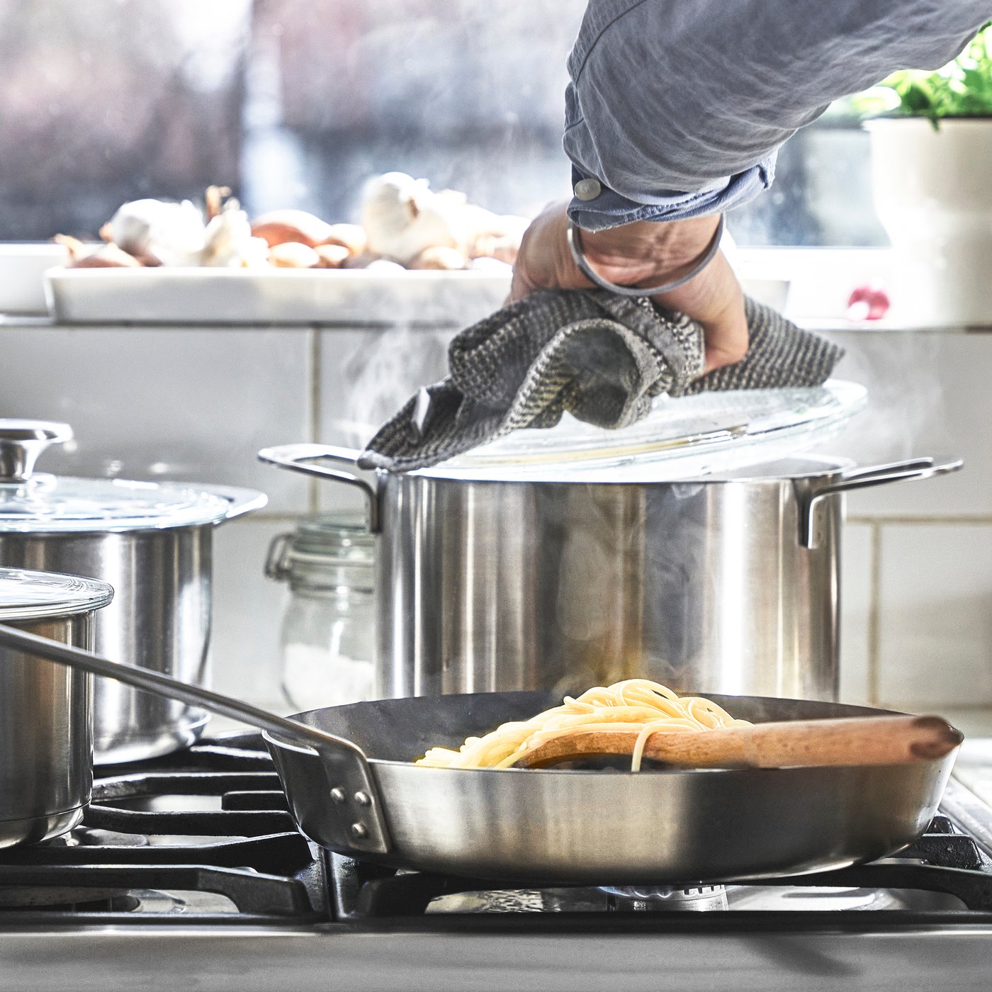 A stainless steel HEMKOMST 7-piece cookware set