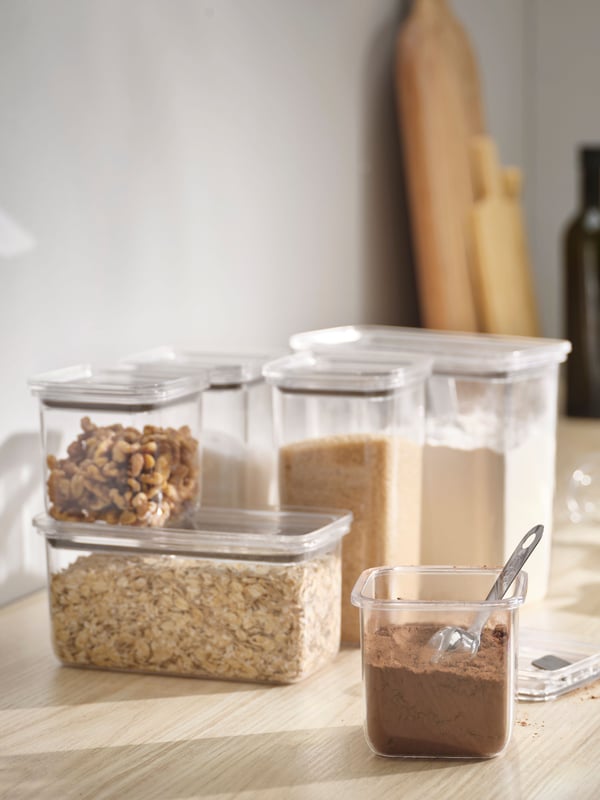 A transparent KORALLVIPPA dry food jar with lid