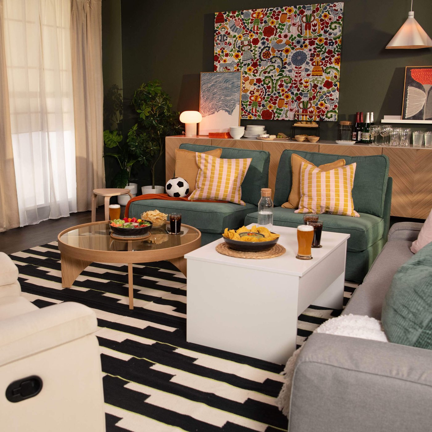 A white ÖSTAVALL adjustable coffee table