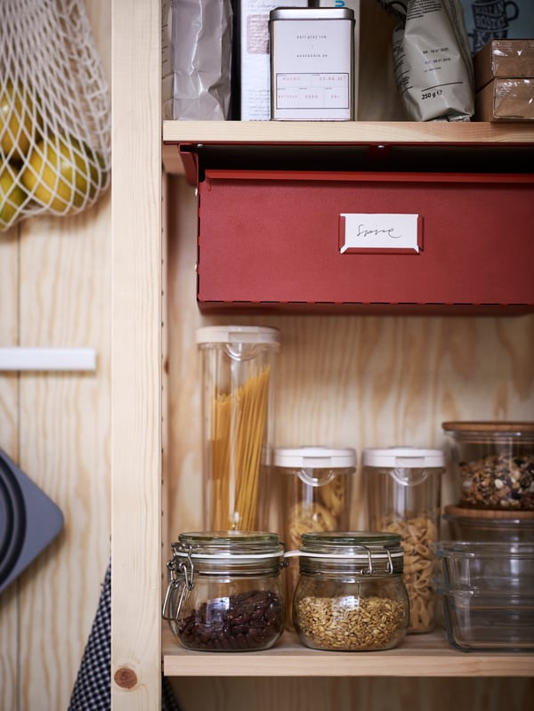 A red IVAR drawer in the kitchen
