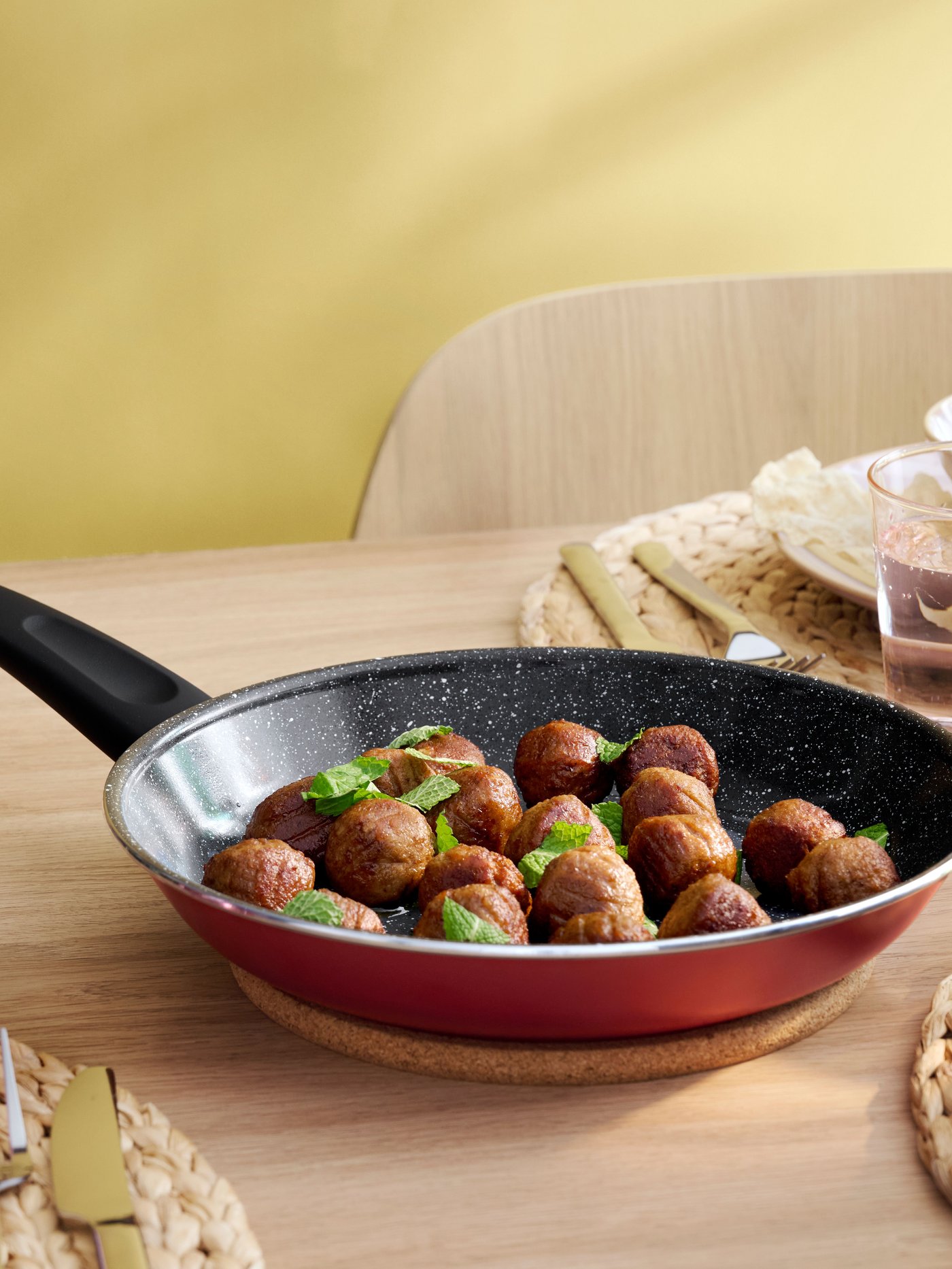 A non-stick coating red HEMLAGAD frying pan