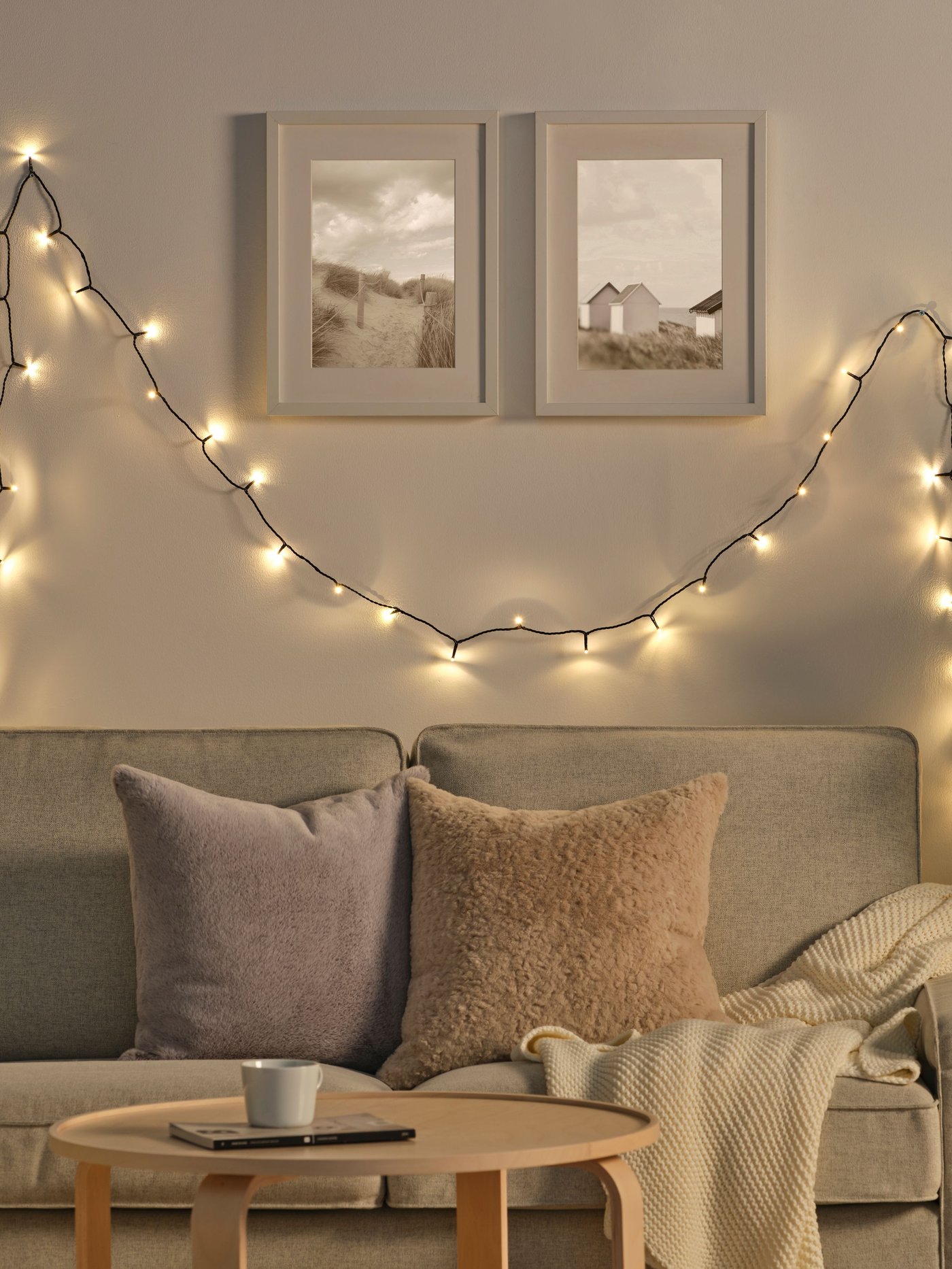 An outdoor GETKÅL LED lighting chain in the living room