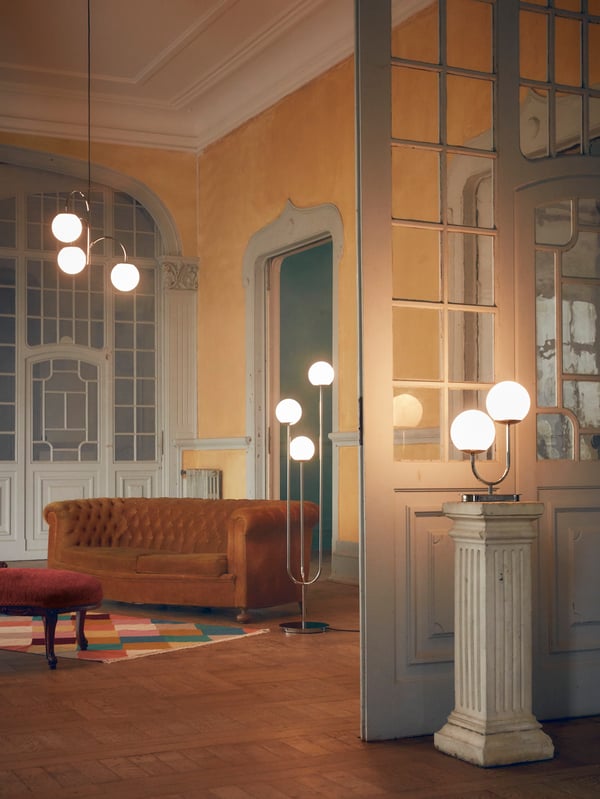 A chrome-plated/opal white glass SIMRISHAMN pendant lamp, 3-armed in the living room