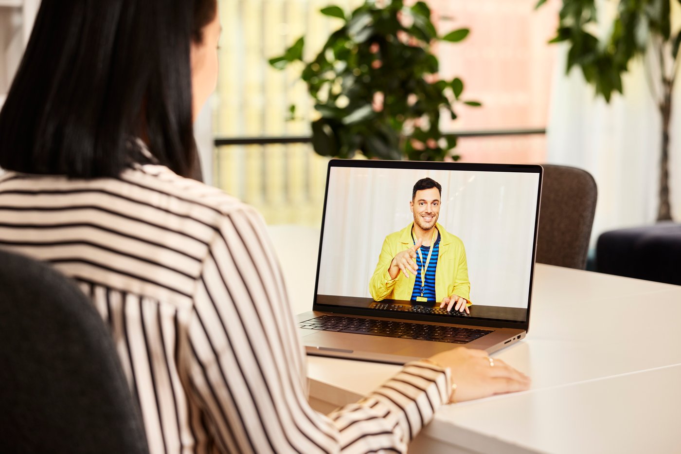 a woman having a video call with an IKEA co-worker.