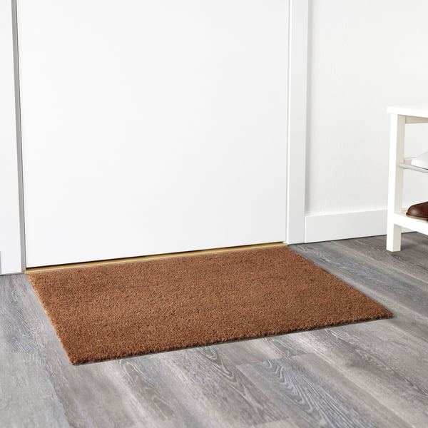 A natural TRAMPA door mat