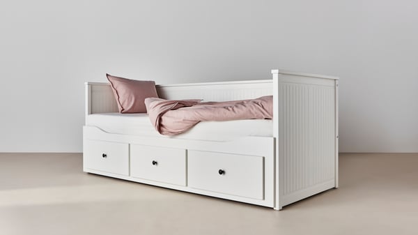 A white HEMNES day-bed frame with 3 drawers