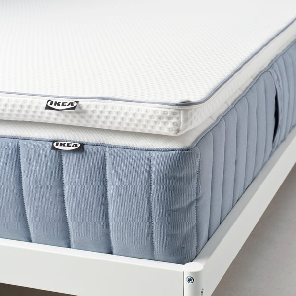 A white NÄSTABERG mattress pad