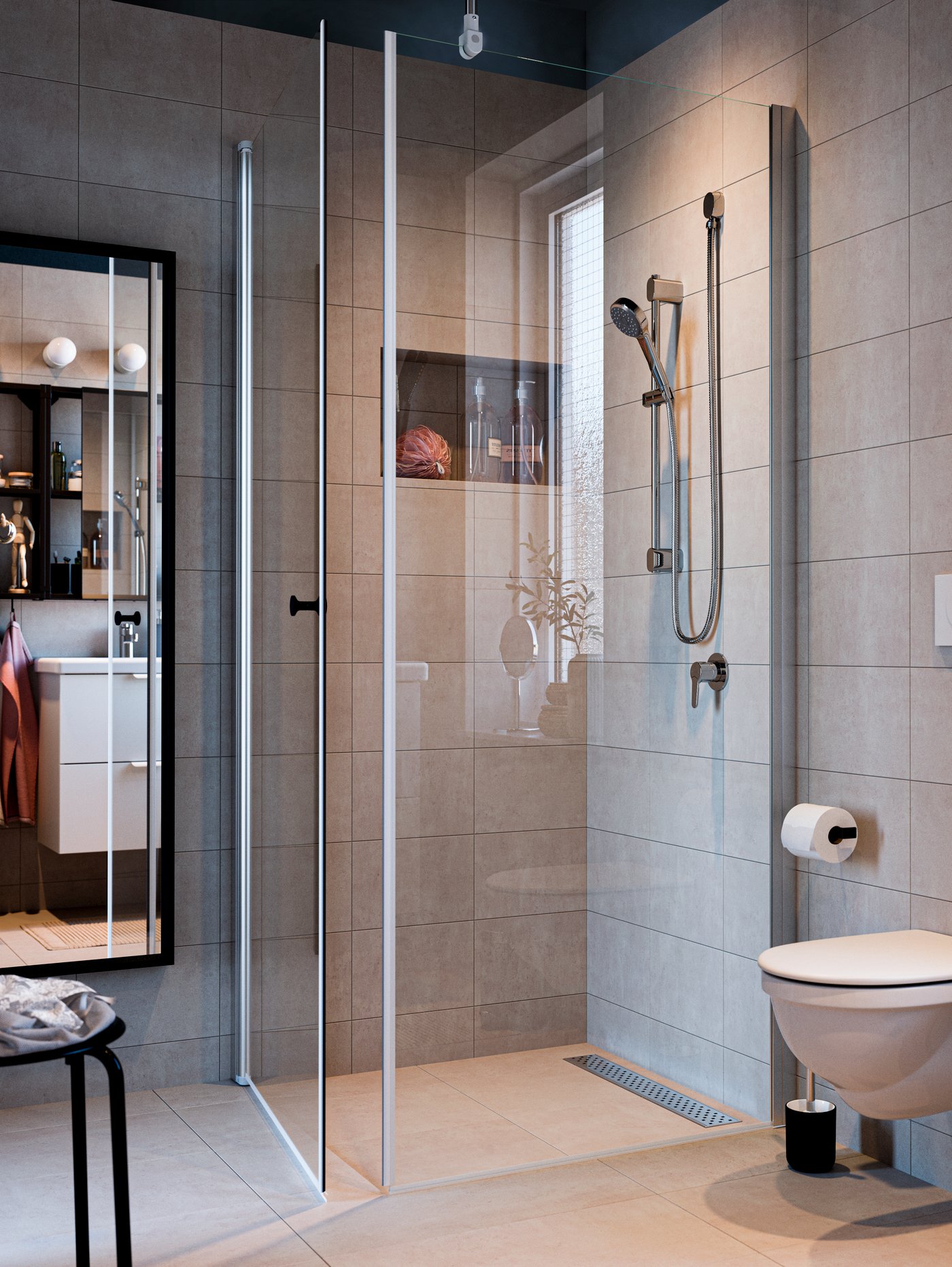 A BROGRUND shower together with an OPPEJEN shower screen and door fitted in a modern bathroom clad in large beige tiles.