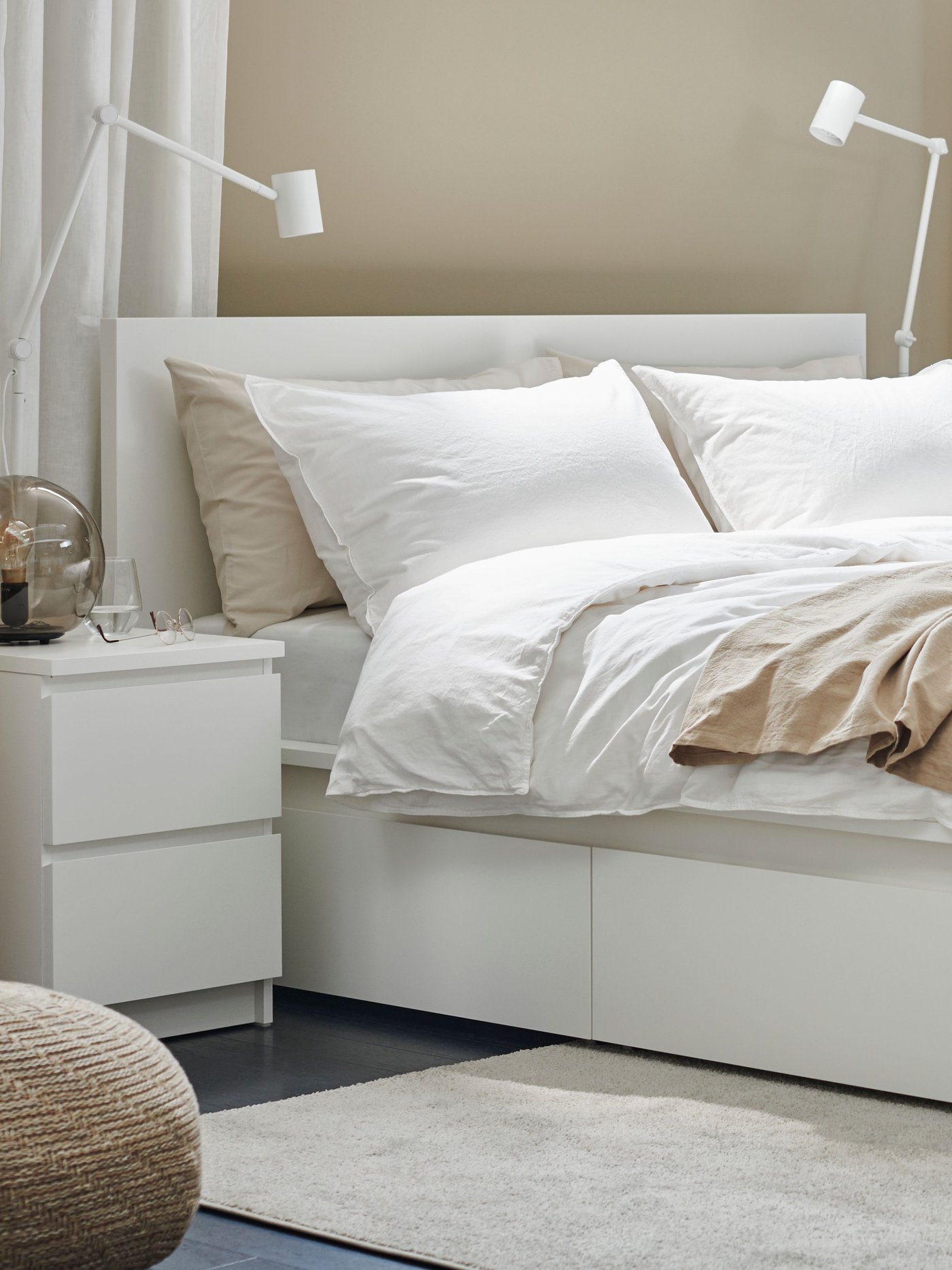 A walnut veneer STOCKHOLM mirror in the bedroom