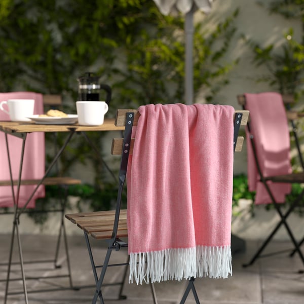 A pink HOLMVI throw