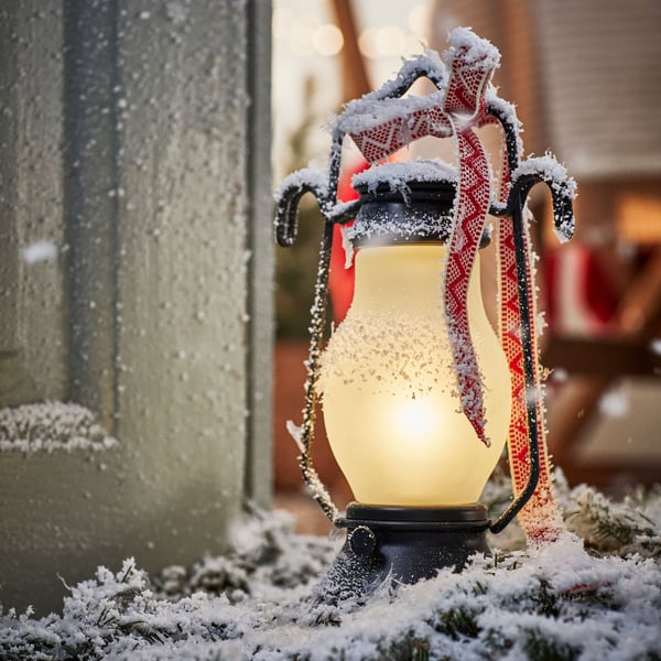 An outdoor metal/dimmable black STRÅLA LED table lamp in the NA