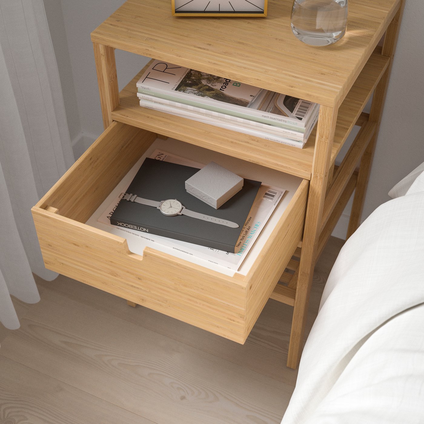 A bamboo NORDKISA bedside table in the bedroom