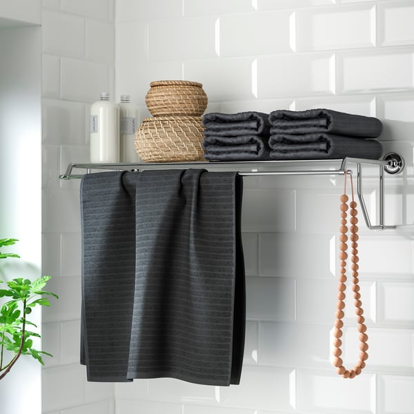 A chrome effect BROFJÄRDEN wall shelf with towel rail