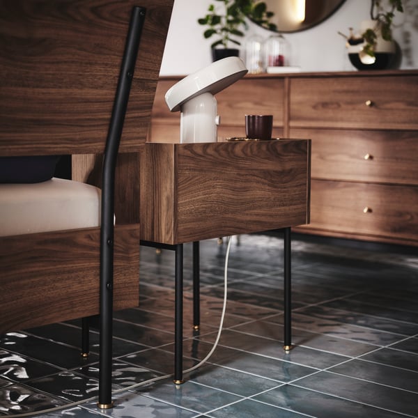 The back of RÅDMANSÖ bedframe and bedside table, showing details that make them look as good from the back as from the front.