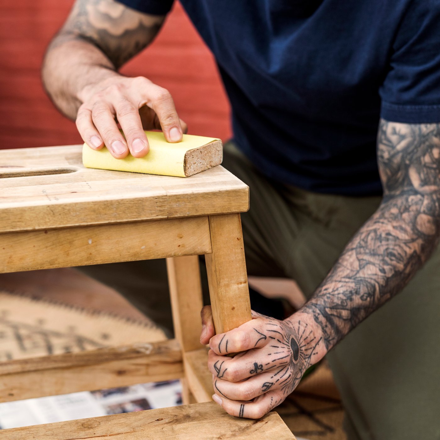 A man repairing a stool.
