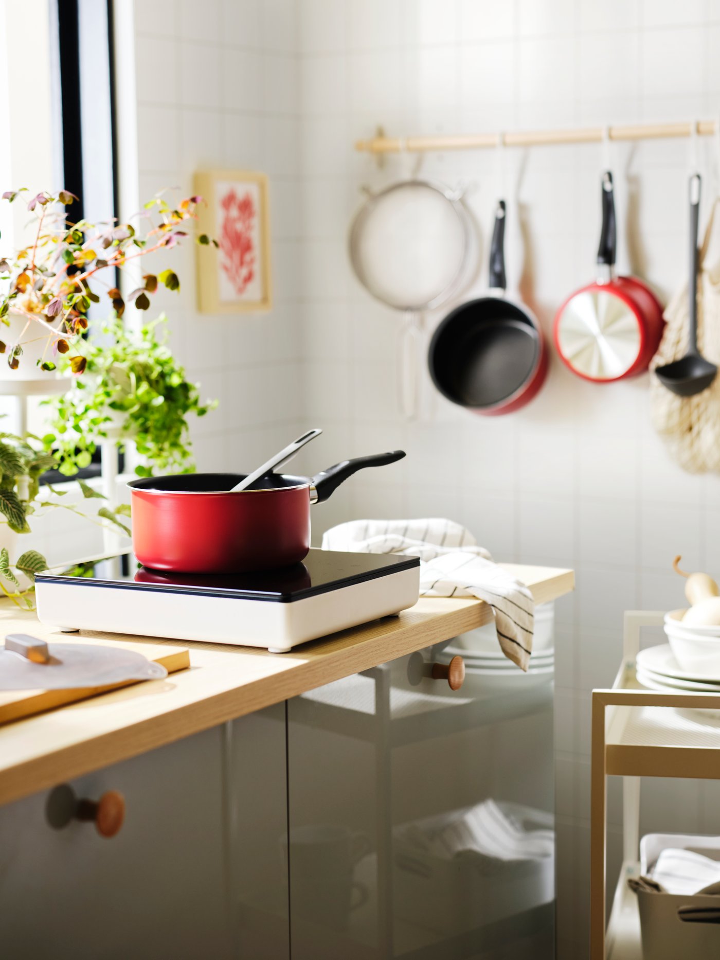 A red KAVALKAD saucepan