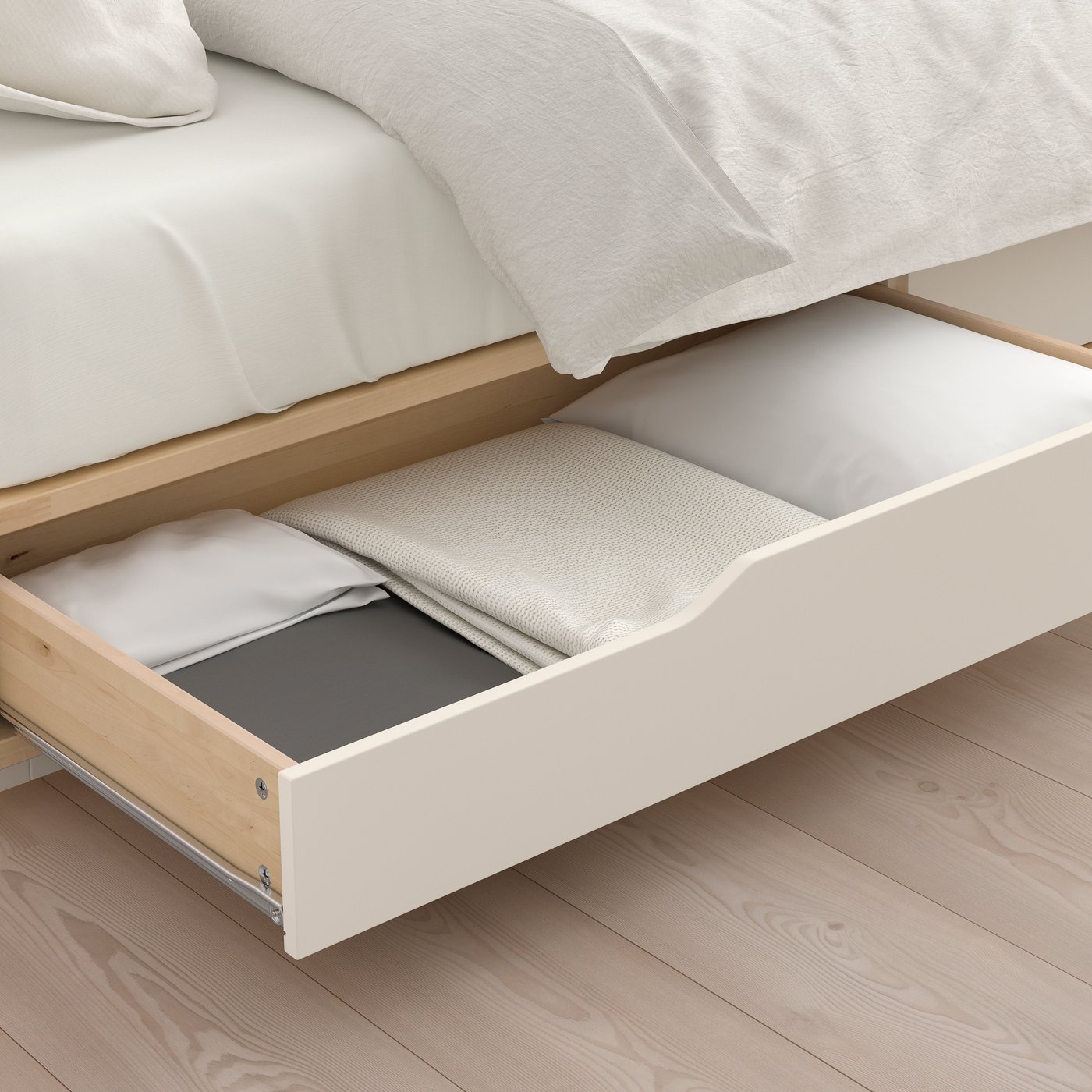 A birch/white MANDAL bed frame with storage