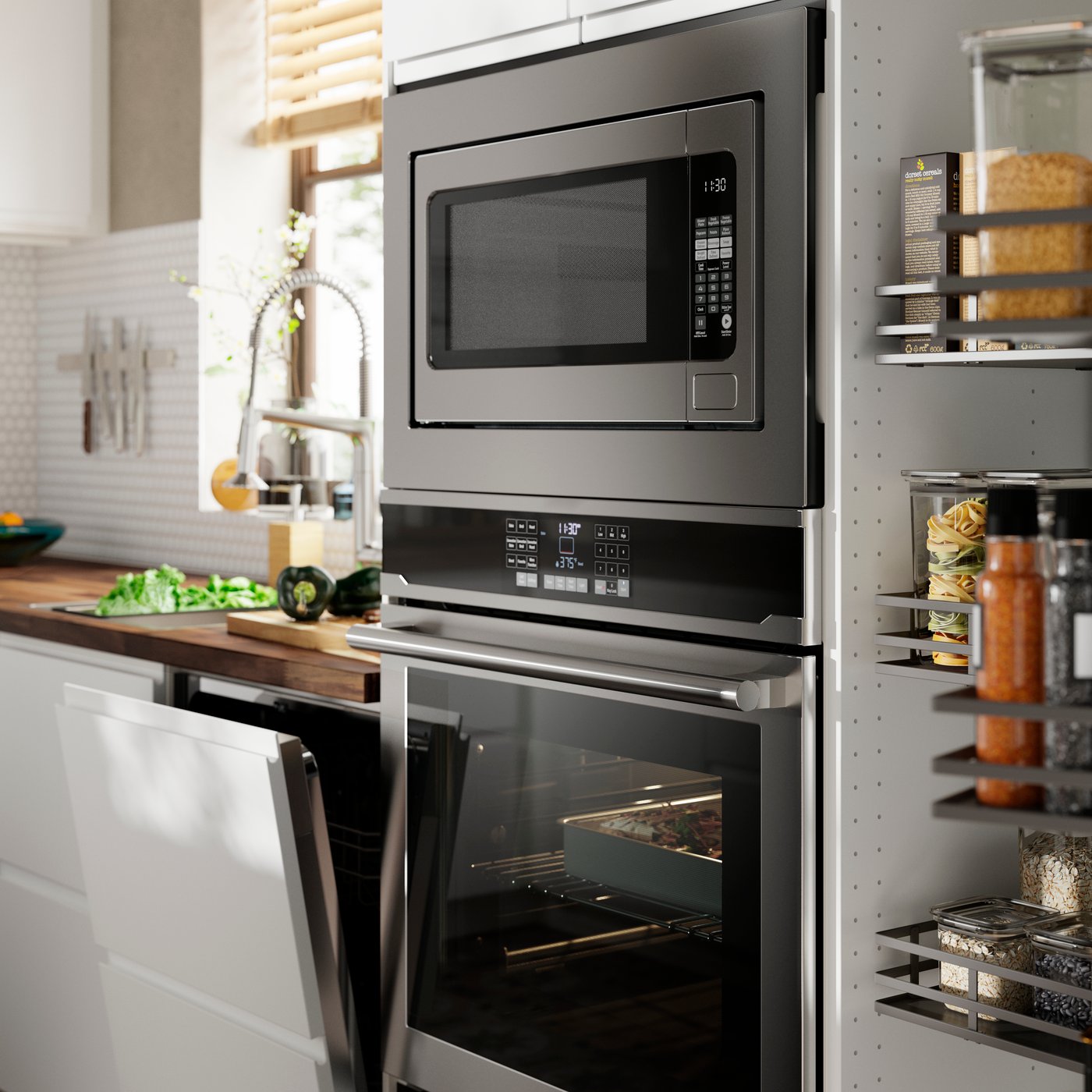 A VASKARBO wall oven and a ÄSKEBO built-in microwave are mounted in a SEKTION high cabinet in a kitchen with white fronts.