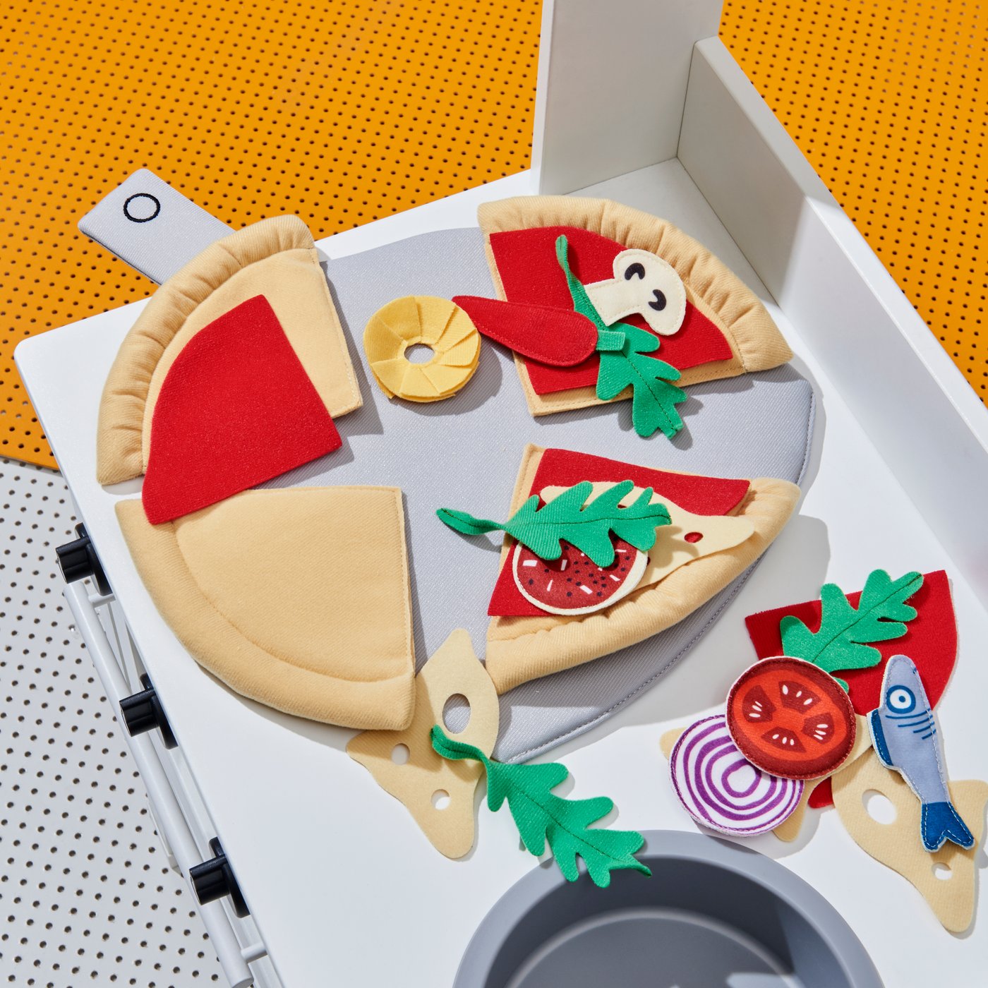 A SPISIG play kitchen with curtains in the childrens room