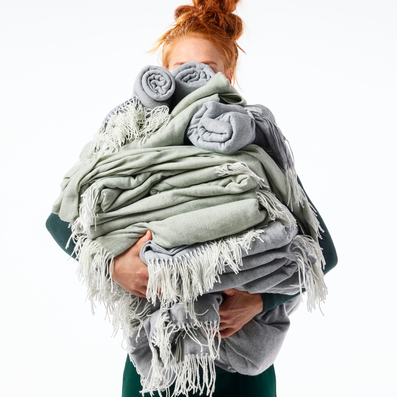 A light grey-green HOLMVI throw