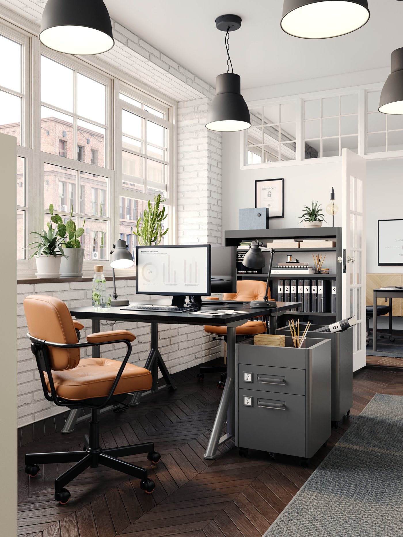 A dark grey IDÅSEN drawer unit on castors